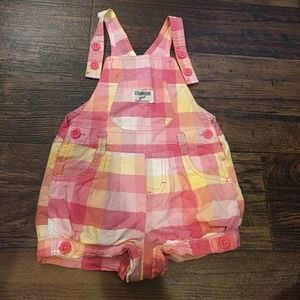 Osh-Kosh short-alls.
